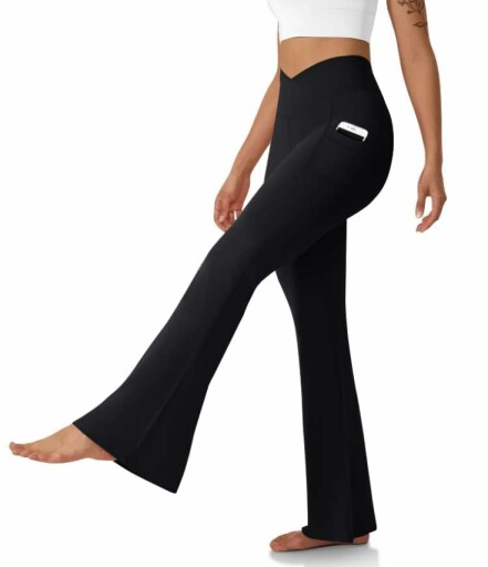 Woman wearing black flared pants and crop tops.