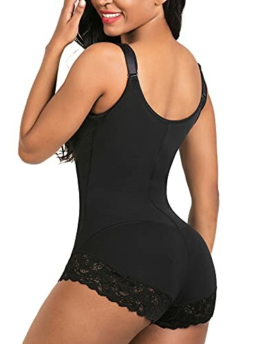 Woman wearing black lace-trimmed bodysuit, back view.