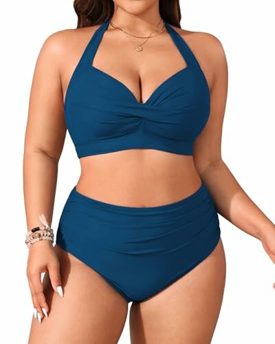 Person wearing a blue halter neck bikini.