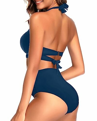 Woman wearing a blue high-waisted bikini