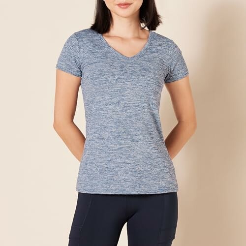 Woman wearing a blue V-neck t-shirt, viewed from the front.