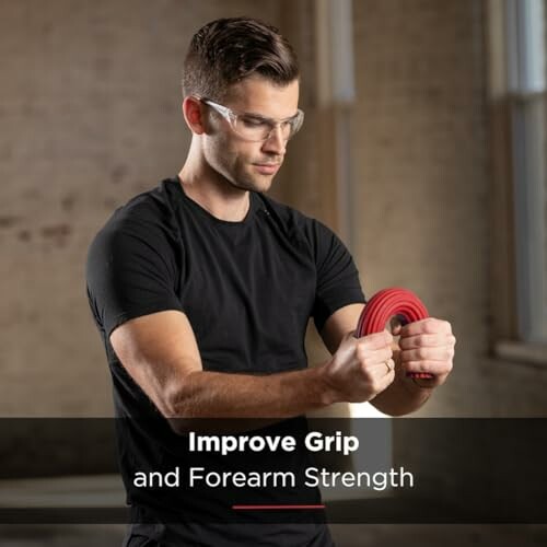 Man using a grip strengthener for forearm exercise