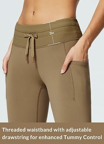 High-waisted yoga pants with adjustable drawstring for tummy control.