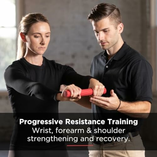 Instructor guiding woman in wrist and forearm resistance training.