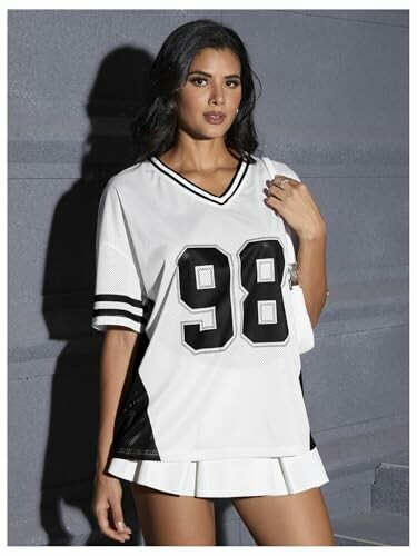 Woman wearing a white jersey with number 98.
